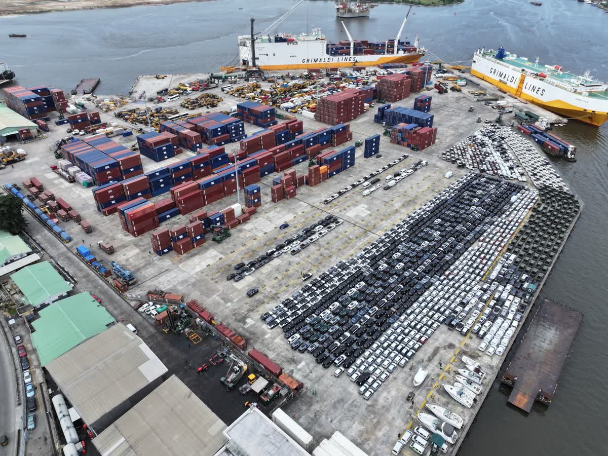Vehicles consolidated on the PTML quay alongside Grimaldi Con-Ro vessels during a transhipment call